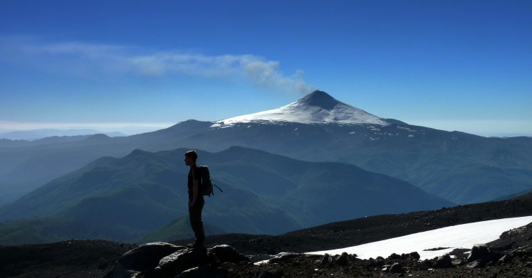 Small eruption from Villarrica volcano, a few days prior to the major eruption of 3 March 2015. Model is Jonathan Moles, PhD student at The Open University.
