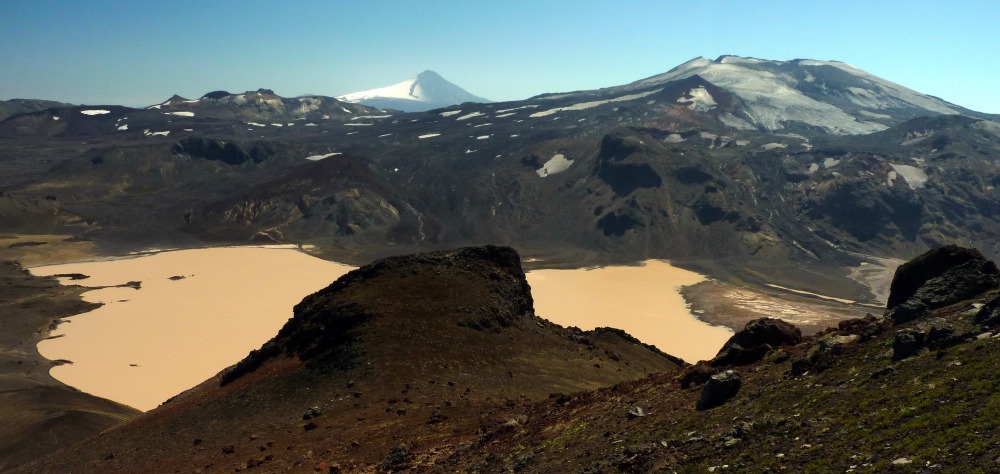 Villarrica (left) after the 3 March 2015 eruption and Quetrupillán (right) with a dusting of ash from the eruption. Lake is Laguna Blanca.